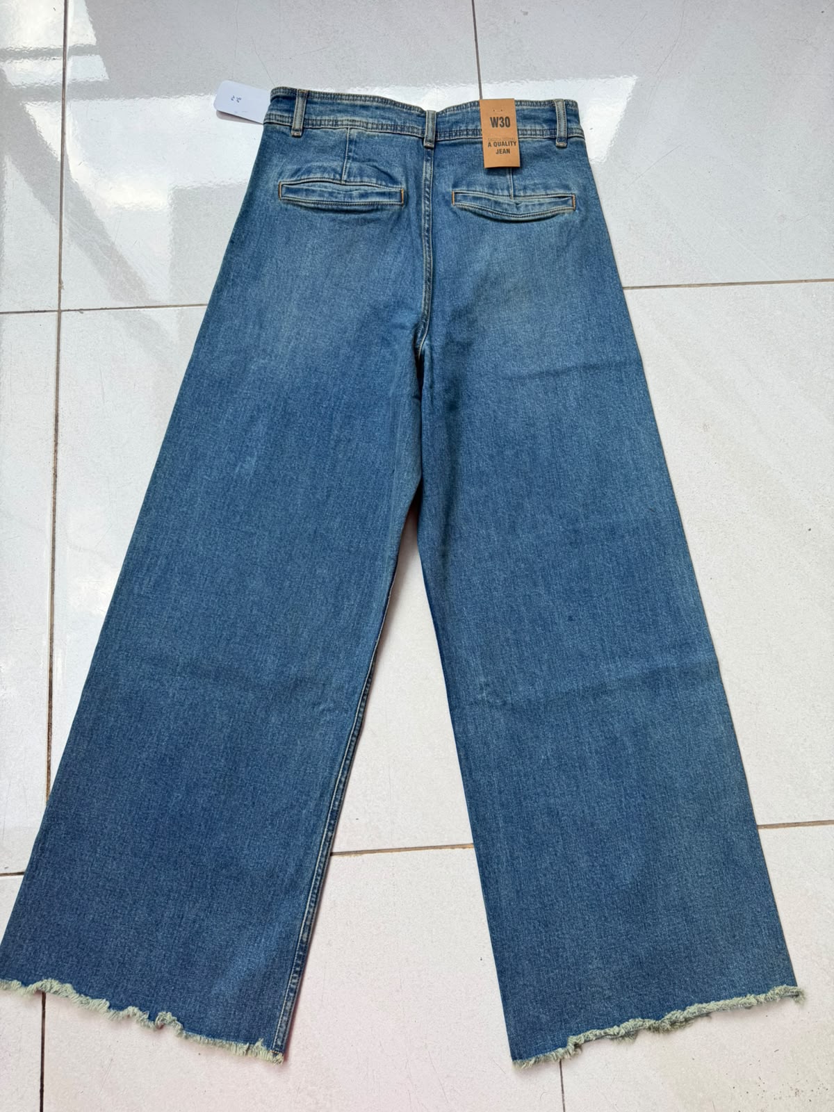 Imported High-Rise Raw Hem Wide-Leg Jeans
